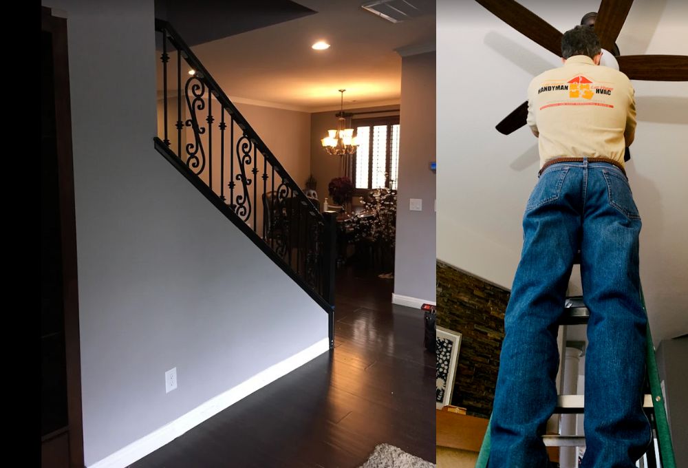 Worker in a safety vest by a staircase, inspecting a wall in the living area.